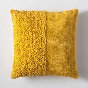 yellow textured throw pillow